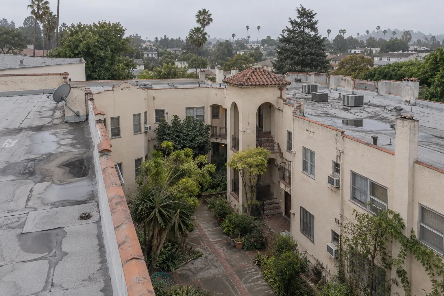 Flat roofs around a 1920s courtyard apartment building, typical of Koreatown