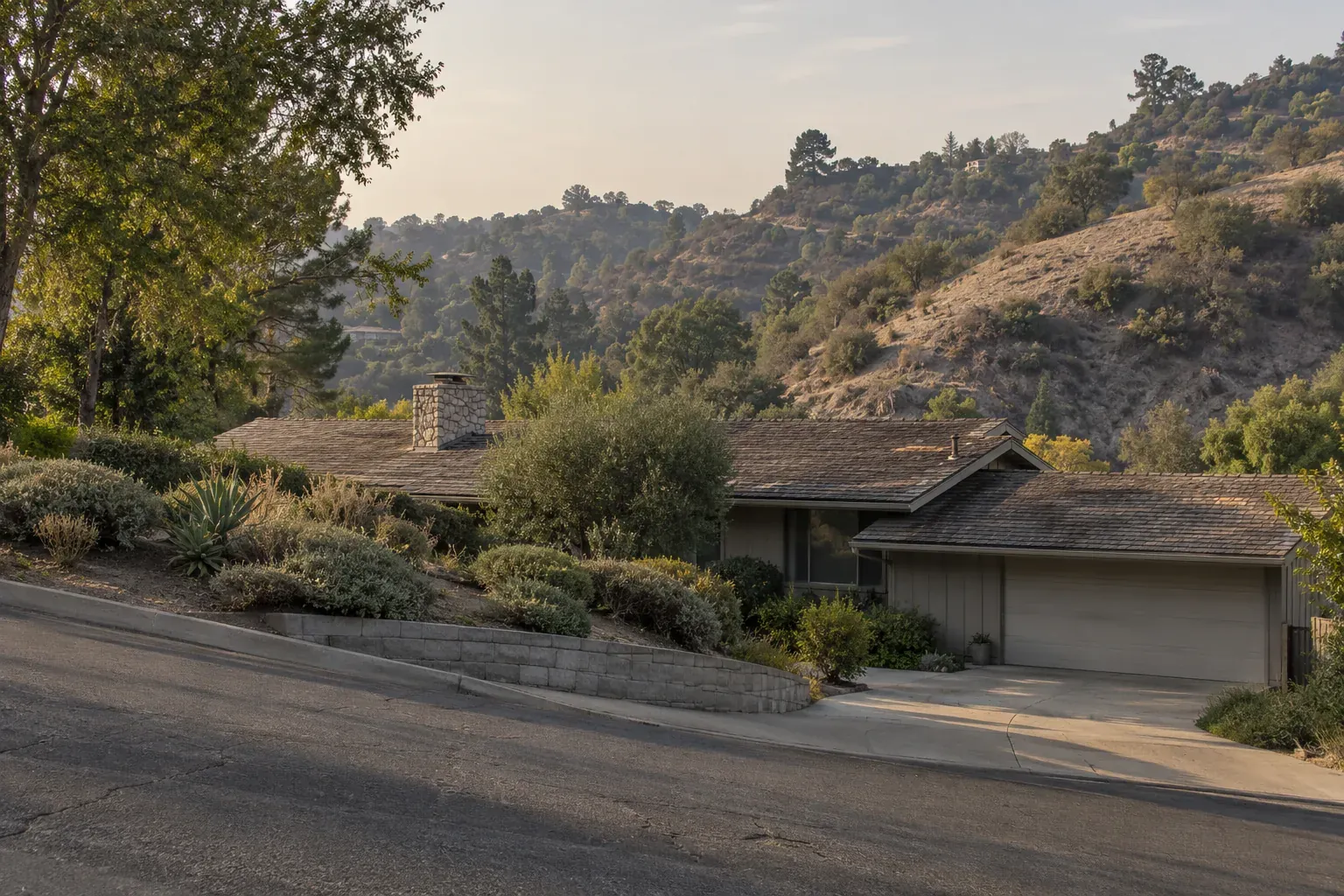 Hillside ranch house with a weathered shingle roof, typical of Sherman Oaks